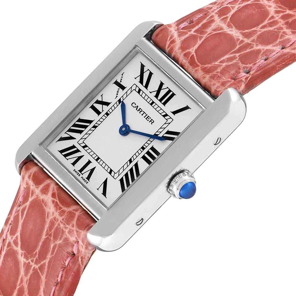 This image shows a Cartier Tank Solo W5200005 Women's Stainless Steel Silver Dial W5200005 Women's Stainless Steel Silver Dial watch at a slight angle, highlighting the rectangular face, Roman numerals, pink leather strap, and blue sapphire crown.