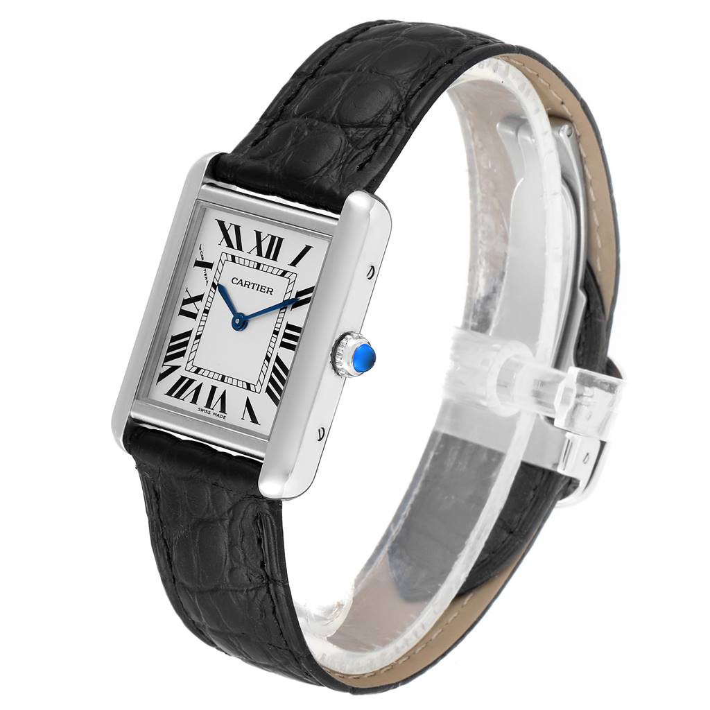 The Cartier Tank Solo W1018255 Women's Stainless Steel Silver Dial W1018255 Women's Stainless Steel Silver Dial watch is shown at an angle, highlighting its rectangular face, black leather strap, and blue cabochon crown.