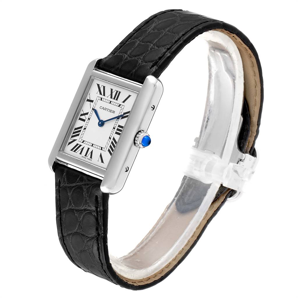 The Cartier Tank Solo W1018255 Women's Stainless Steel Silver Dial W1018255 Women's Stainless Steel Silver Dial watch is shown at an oblique angle, highlighting its rectangular face, black leather strap, and blue cabochon crown.