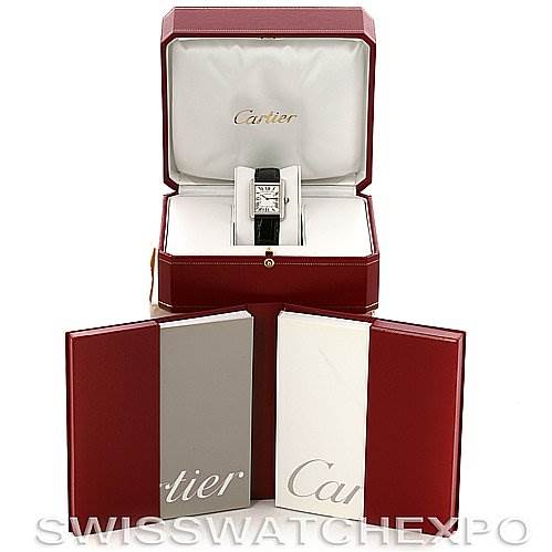 The Cartier Tank Solo W1018255 Women's Stainless Steel Silver Dial W1018255 Women's Stainless Steel Silver Dial watch is displayed front-facing in an open box with accompanying booklets in front.