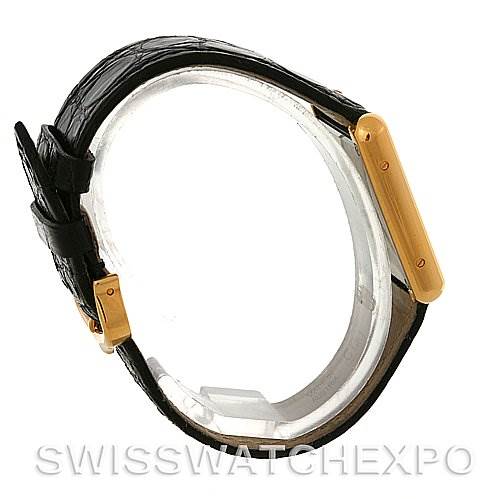 The image shows a side view of the Cartier Tank Solo W1018755 Women's Steel and Gold (two tone) Silver Dial W1018755 Women's Steel and Gold (two tone) Silver Dial watch, highlighting its black leather strap and golden case.