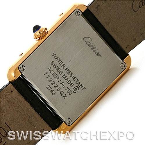 The image shows the back case of a Cartier Tank Solo W1018755 Women's Steel and Gold (two tone) Silver Dial W1018755 Women's Steel and Gold (two tone) Silver Dial watch, highlighting the engraved details and the leather strap.