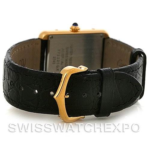 The image shows the back of a Cartier Tank Solo W1018755 Women's Steel and Gold (two tone) Silver Dial W1018755 Women's Steel and Gold (two tone) Silver Dial watch, focusing on the gold buckle and black leather strap.