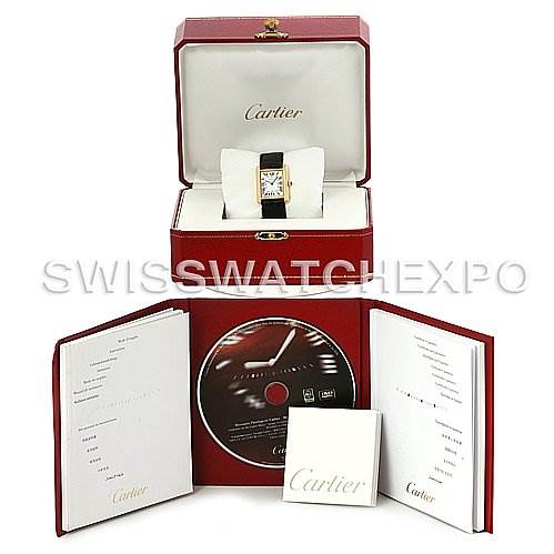 The image shows a Cartier Tank Solo W1018755 Women's Steel and Gold (two tone) Silver Dial W1018755 Women's Steel and Gold (two tone) Silver Dial watch with its original box, manuals, and a CD, all displayed from a front angle.