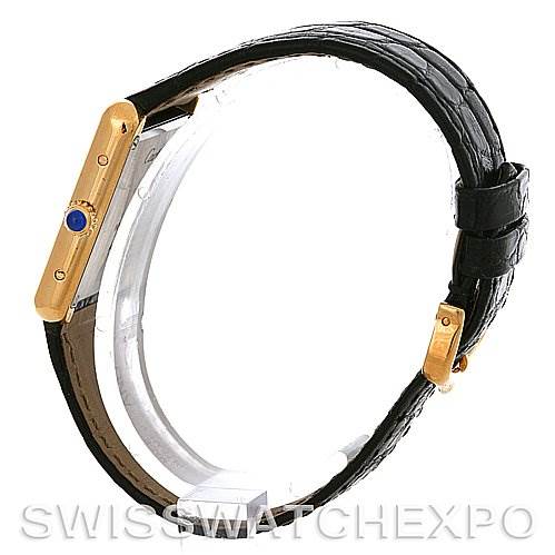 The image shows a side view of a Cartier Tank Solo W1018755 Women
s Steel and Gold (two tone) Silver Dial W1018755 Women
s Steel and Gold (two tone) Silver Dial watch, highlighting its gold case and black leather strap.