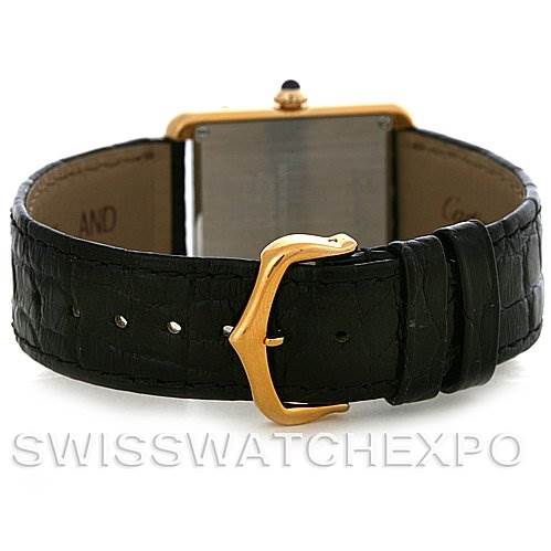 The image shows the rear view of a Cartier Tank Solo W1018755 Women
s Steel and Gold (two tone) Silver Dial W1018755 Women
s Steel and Gold (two tone) Silver Dial watch, highlighting the black leather strap and gold buckle.