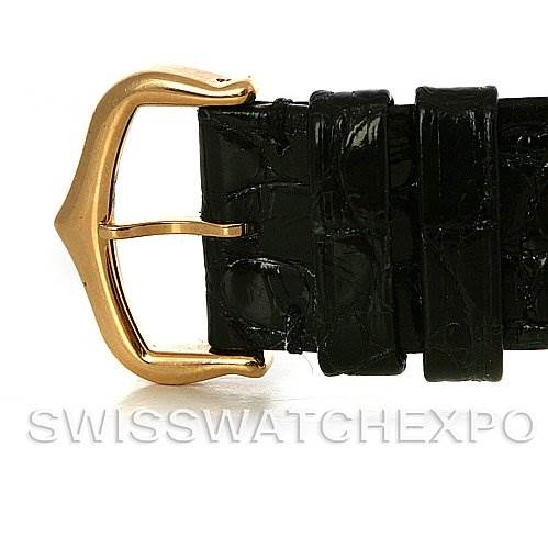 The image shows a close-up of the gold buckle and black leather strap of a Cartier Tank Solo W1018755 Women
s Steel and Gold (two tone) Silver Dial W1018755 Women
s Steel and Gold (two tone) Silver Dial watch.