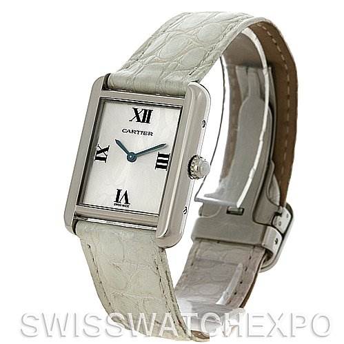 This image shows a Cartier Tank Solo W1019555 Women's Stainless Steel Silver Dial W1019555 Women's Stainless Steel Silver Dial watch at an angle displaying its face, white textured strap, side crown, and buckle clasp.