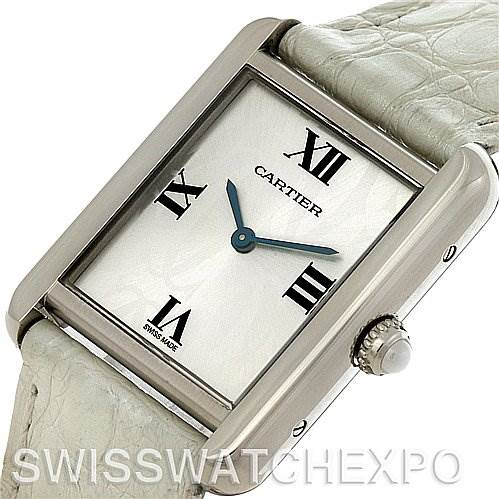 The image shows a Cartier Tank Solo W1019555 Women's Stainless Steel Silver Dial W1019555 Women's Stainless Steel Silver Dial watch face at an angled view with visible crown and part of the white leather strap.