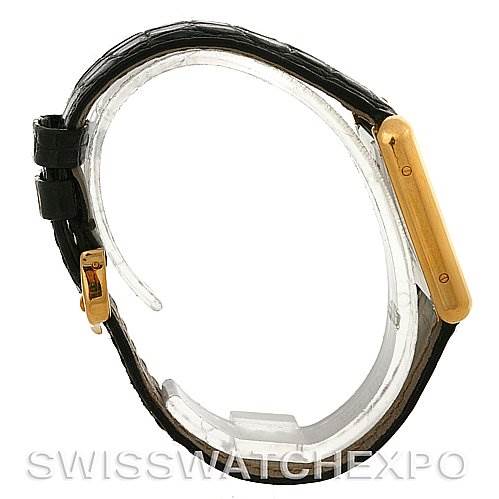 This image shows a side view of the Cartier Tank Solo W1018755 Women's Steel and Gold (two tone) Silver Dial W1018755 Women's Steel and Gold (two tone) Silver Dial watch, highlighting the gold case and black leather strap.