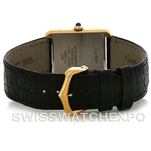 This image shows the back view of a Cartier Tank Solo W1018755 Women's Steel and Gold (two tone) Silver Dial W1018755 Women's Steel and Gold (two tone) Silver Dial watch, focusing on the black leather strap and the gold buckle.