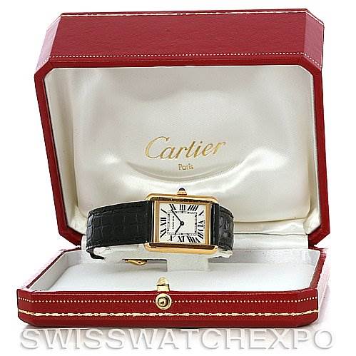The image shows a Cartier Tank Solo W1018755 Women's Steel and Gold (two tone) Silver Dial W1018755 Women's Steel and Gold (two tone) Silver Dial watch placed inside an open red Cartier case, revealing the watch's face and black strap.