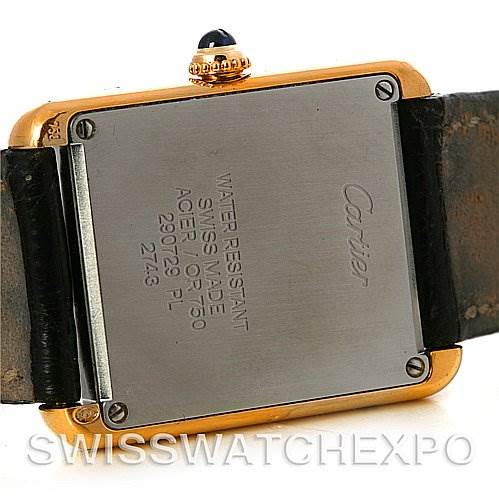 This image shows the back case and part of the band of a Cartier Tank Solo W1018755 Women
s Steel and Gold (two tone) Silver Dial W1018755 Women
s Steel and Gold (two tone) Silver Dial watch.