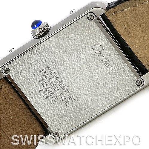 The image shows the back plate and leather strap of the Cartier Tank Solo W1018255 Women's Stainless Steel Silver Dial W1018255 Women's Stainless Steel Silver Dial watch, highlighting its engravings and crown with a blue cabochon.
