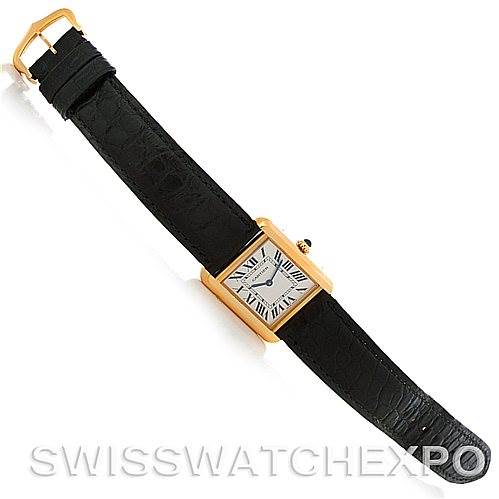 The image shows an overhead view of a Cartier Tank Solo W1018755 Women's Steel and Gold (two tone) Silver Dial W1018755 Women's Steel and Gold (two tone) Silver Dial watch, displaying its rectangular face, black strap, and gold-tone case.