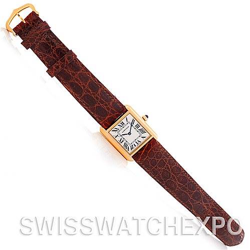 The image shows a top-down view of a Cartier Tank Solo W1018755 Women's Steel and Gold (two tone) Silver Dial W1018755 Women's Steel and Gold (two tone) Silver Dial watch with a brown leather strap and a rectangular dial.