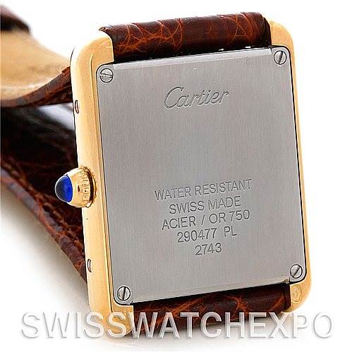 The image shows the back case of a Cartier Tank Solo W1018755 Women's Steel and Gold (two tone) Silver Dial W1018755 Women's Steel and Gold (two tone) Silver Dial watch, highlighting its water resistance and Swiss made features.