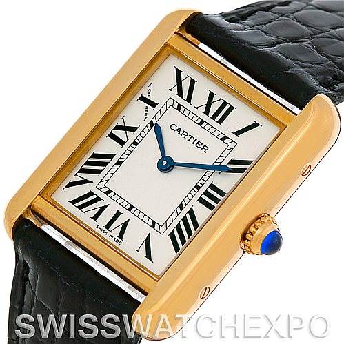 The image shows a Cartier Tank Solo W1018755 Women's Steel and Gold (two tone) Silver Dial W1018755 Women's Steel and Gold (two tone) Silver Dial watch in a close-up, angled view, highlighting the face, crown, and part of the leather strap.