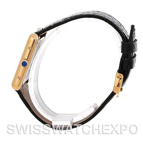 The image shows a side view of the Cartier Tank Solo W1018755 Women's Steel and Gold (two tone) Silver Dial W1018755 Women's Steel and Gold (two tone) Silver Dial watch, highlighting the case, crown, and strap.