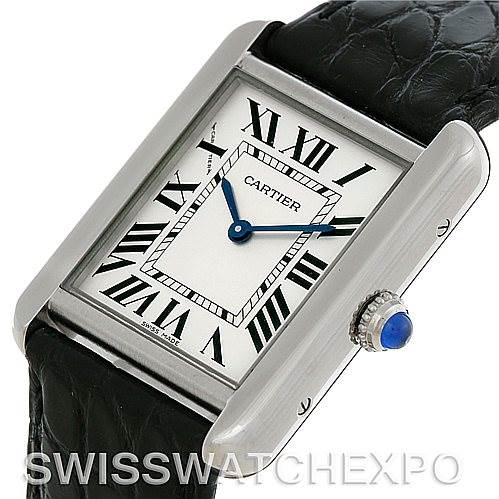 This image shows a Cartier Tank Solo W1018255 Women's Stainless Steel Silver Dial W1018255 Women's Stainless Steel Silver Dial watch at an angle displaying its rectangular face, Roman numeral dial, blue sword-shaped hands, and black leather strap.