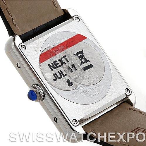 The image shows the back casing, crown, and part of the strap of a Cartier Tank Solo W1018255 Women's Silver Dial W1018255 Women's Silver Dial watch.