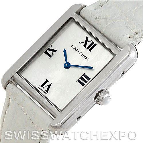 This image shows a top-down view of the Cartier Tank Solo W1019555 Women's Stainless Steel Silver Dial W1019555 Women's Stainless Steel Silver Dial watch face and part of the white leather strap.