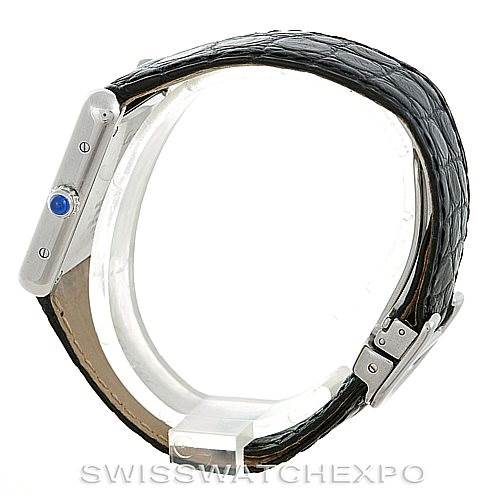 This image shows a side view of the Cartier Tank Solo W1018255 Women's Stainless Steel Silver Dial W1018255 Women's Stainless Steel Silver Dial watch, highlighting its case, crown with blue gemstone, and black leather strap.