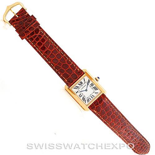 This image shows a top-down view of a Cartier Tank Solo W1018755 Women's Steel and Gold (two tone) Silver Dial W1018755 Women's Steel and Gold (two tone) Silver Dial watch with a brown leather strap and gold casing.