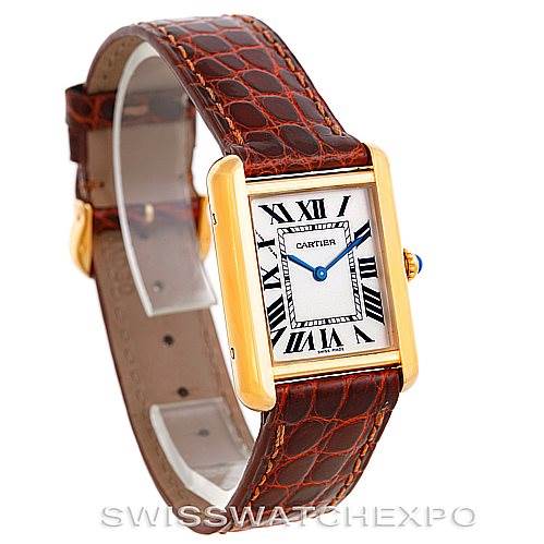 The image shows a Cartier Tank Solo W1018755 Women's Steel and Gold (two tone) Silver Dial W1018755 Women's Steel and Gold (two tone) Silver Dial watch at a slight angle, highlighting its rectangular face, gold casing, and brown leather strap.