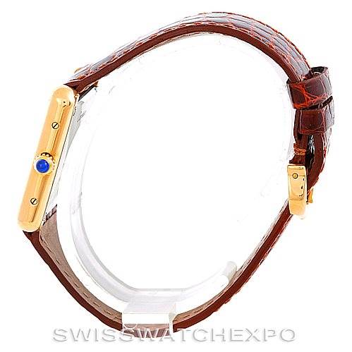 This is a side view of the Cartier Tank Solo W1018755 Women's Steel and Gold (two tone) Silver Dial W1018755 Women's Steel and Gold (two tone) Silver Dial watch, showcasing the crown and the leather strap.