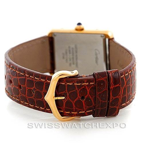 The image shows the back and the leather strap with buckle of a Cartier Tank Solo W1018755 Women's Steel and Gold (two tone) Silver Dial W1018755 Women's Steel and Gold (two tone) Silver Dial watch.