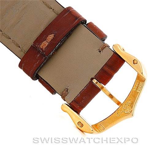 This is a close-up of the leather strap and gold buckle of the Cartier Tank Solo W1018755 Women's Steel and Gold (two tone) Silver Dial W1018755 Women's Steel and Gold (two tone) Silver Dial watch, viewed from above.