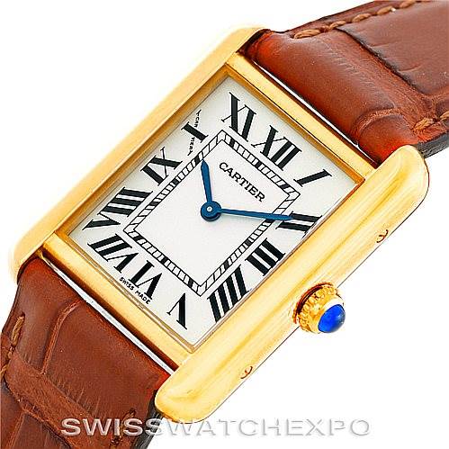 The image shows a close-up of the face and part of the strap of a Cartier Tank Solo W1018755 Women's Steel and Gold (two tone) Silver Dial W1018755 Women's Steel and Gold (two tone) Silver Dial watch with a gold case and leather strap.