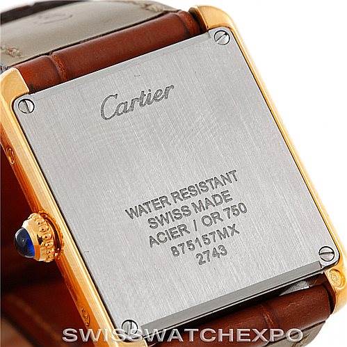 The image shows the back case of a Cartier Tank Solo W1018755 Women's Steel and Gold (two tone) Silver Dial W1018755 Women's Steel and Gold (two tone) Silver Dial watch, highlighting the brand engraving, water resistance, and material specifications.