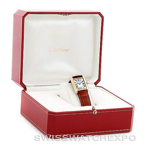 The Cartier Tank Solo W1018755 Women's Steel and Gold (two tone) Silver Dial W1018755 Women's Steel and Gold (two tone) Silver Dial watch is displayed in an open red and white Cartier box, showcasing the watch face and brown leather strap.