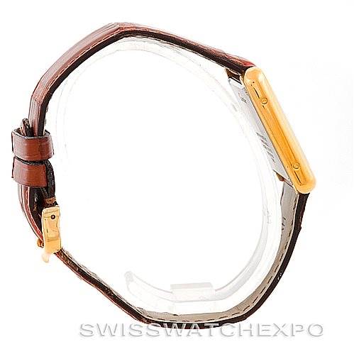 The image shows a Cartier Tank Solo W1018755 Women's Steel and Gold (two tone) Silver Dial W1018755 Women's Steel and Gold (two tone) Silver Dial watch from a side angle, highlighting the brown leather strap and the gold case.