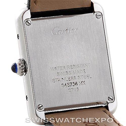The image shows the back case of a Cartier Tank Solo W1018255 Women's Stainless Steel Silver Dial W1018255 Women's Stainless Steel Silver Dial watch, featuring the engravings and crown with a blue cabochon.