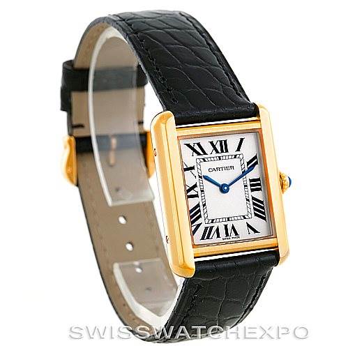 The Cartier Tank Solo W1018755 Women's Steel and Gold (two tone) Silver Dial W1018755 Women's Steel and Gold (two tone) Silver Dial watch is shown at a three-quarter angle, highlighting its rectangular face, black leather strap, and gold casing.