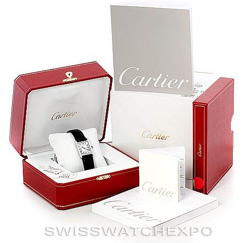 The Cartier Tank Solo W1018255 Women's Stainless Steel Silver Dial W1018255 Women's Stainless Steel Silver Dial watch is shown in its case at a three-quarter angle, along with its outer box and accompanying documents.