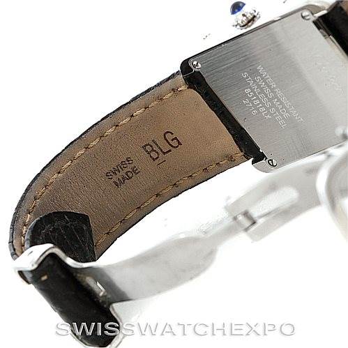 The image shows the back and side of a Tank Solo model by Cartier, highlighting its leather strap and stainless steel case.