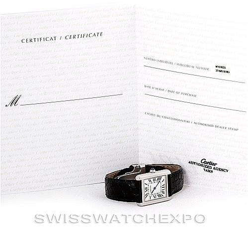 The image shows a Tank Solo model by Cartier with its certificate and paperwork in the background.