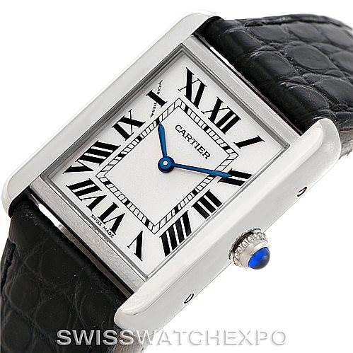 This image shows a Cartier Tank Solo W1018255 Women's Stainless Steel Silver Dial W1018255 Women's Stainless Steel Silver Dial watch viewed from an angle displaying its face, blue hands, Roman numerals, and a leather strap.