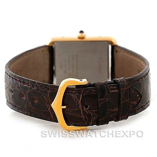 The image shows the Cartier Tank Solo W1018755 Women's Steel and Gold (two tone) Silver Dial W1018755 Women's Steel and Gold (two tone) Silver Dial watch from a rear angle, highlighting its leather strap and gold clasp.