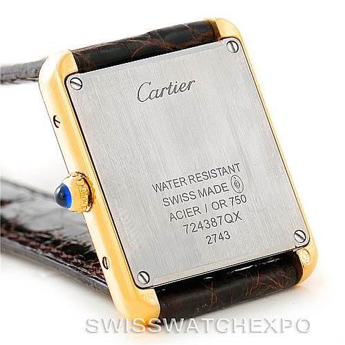 The image shows the back case and crown of a Cartier Tank Solo W1018755 Women's Steel and Gold (two tone) Silver Dial W1018755 Women's Steel and Gold (two tone) Silver Dial watch, highlighting its water resistance and model information.