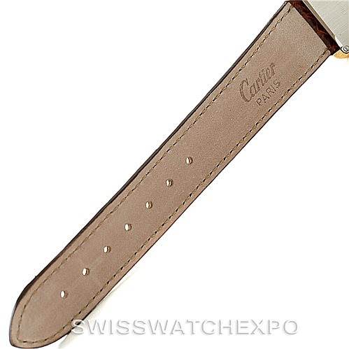 The image shows a close-up of the leather strap with "Cartier Paris" engraved, from the Tank Solo model by Cartier.