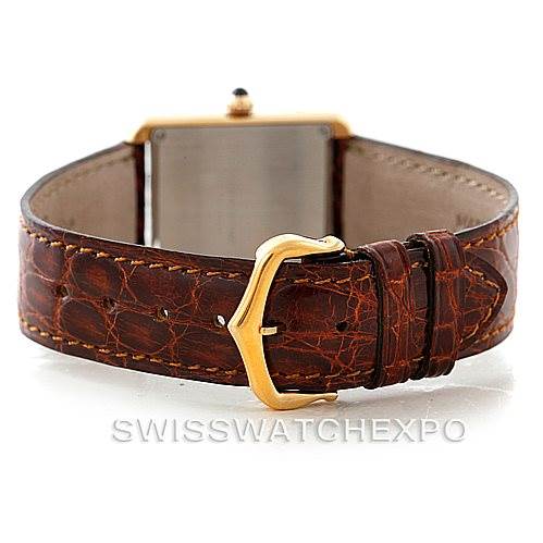 This image shows the back case and clasp of a Cartier Tank Solo W1018755 Women's Steel and Gold (two tone) Silver Dial W1018755 Women's Steel and Gold (two tone) Silver Dial watch with a brown leather strap.