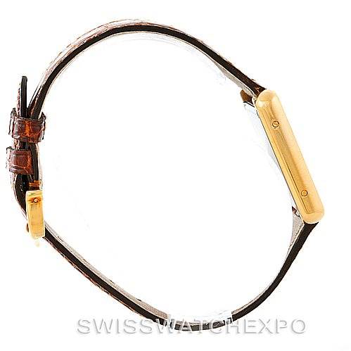 The image shows a side view of the Cartier Tank Solo W1018755 Women's Steel and Gold (two tone) Silver Dial W1018755 Women's Steel and Gold (two tone) Silver Dial watch, highlighting its case, crown, and leather strap.