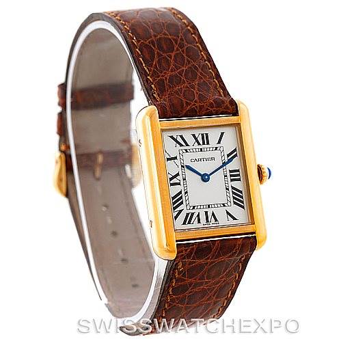 The image shows a Cartier Tank Solo W1018755 Women's Steel and Gold (two tone) Silver Dial W1018755 Women's Steel and Gold (two tone) Silver Dial watch at a slight angle, displaying its face, gold case, leather strap, and blue crown.