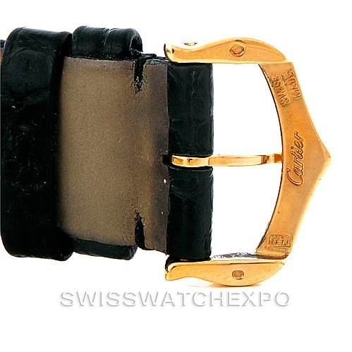 This image shows a close-up of the gold buckle clasp on a black leather strap for the Cartier Tank Solo W1018755 Women's Steel and Gold (two tone) Silver Dial W1018755 Women's Steel and Gold (two tone) Silver Dial watch.