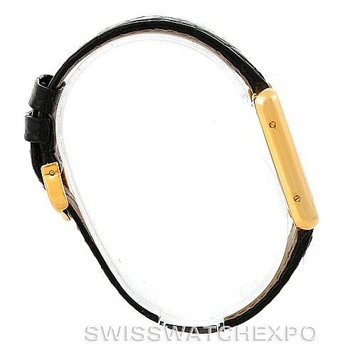 The image shows a Cartier Tank Solo W1018755 Women's Steel and Gold (two tone) Silver Dial W1018755 Women's Steel and Gold (two tone) Silver Dial watch in a side angle, highlighting the gold case and black leather strap.